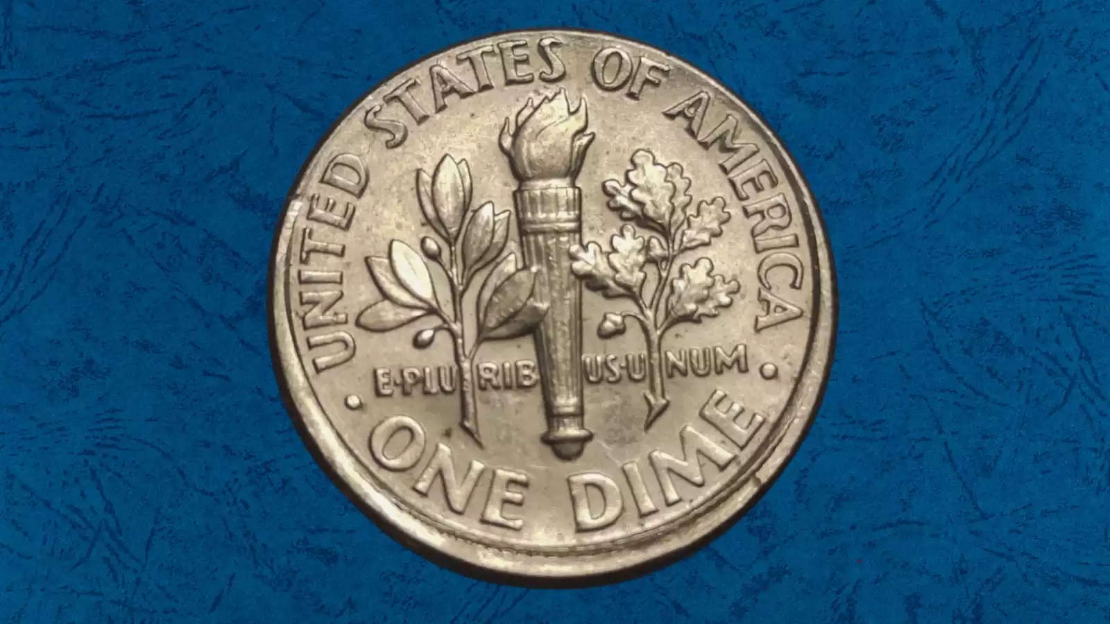 1952 Roosevelt dime off-center strike showing blank crescent and misaligned design