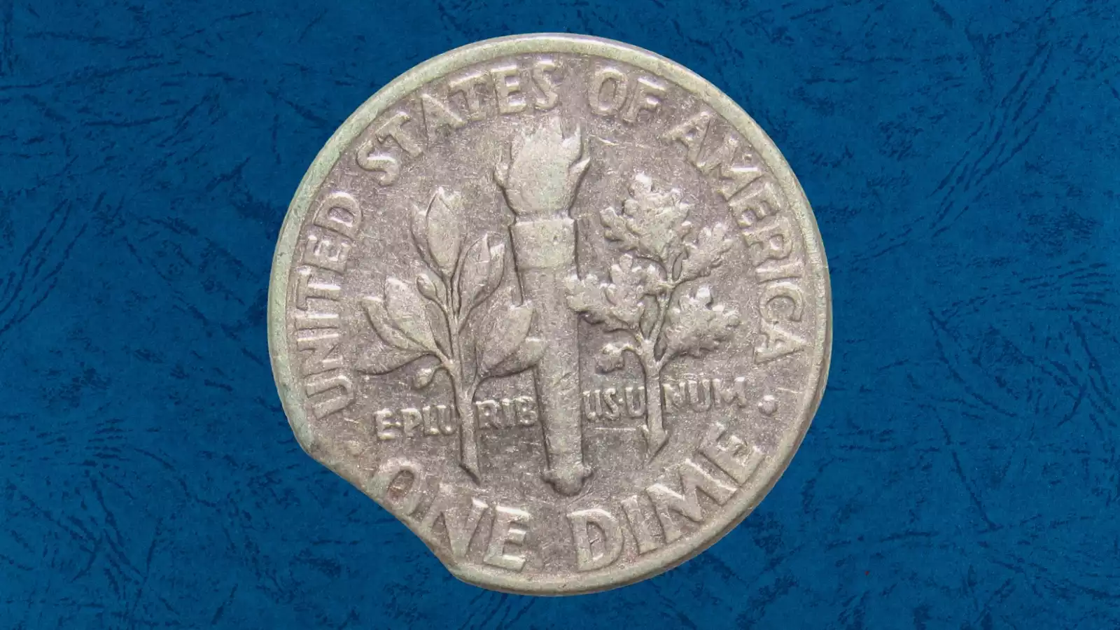 1952 Roosevelt dime clipped planchet error showing curved bite missing from coin edge